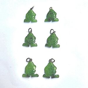 Six stylized Buddha type pendants